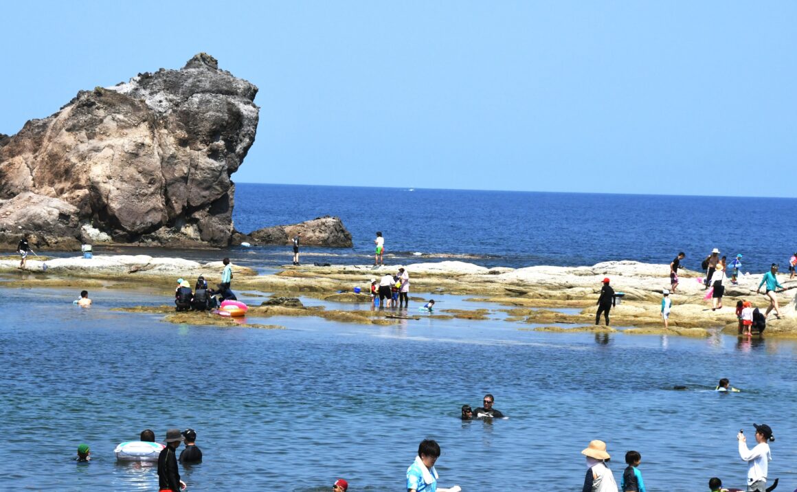 Varied beautiful coastal landscape, play at rocky shore.